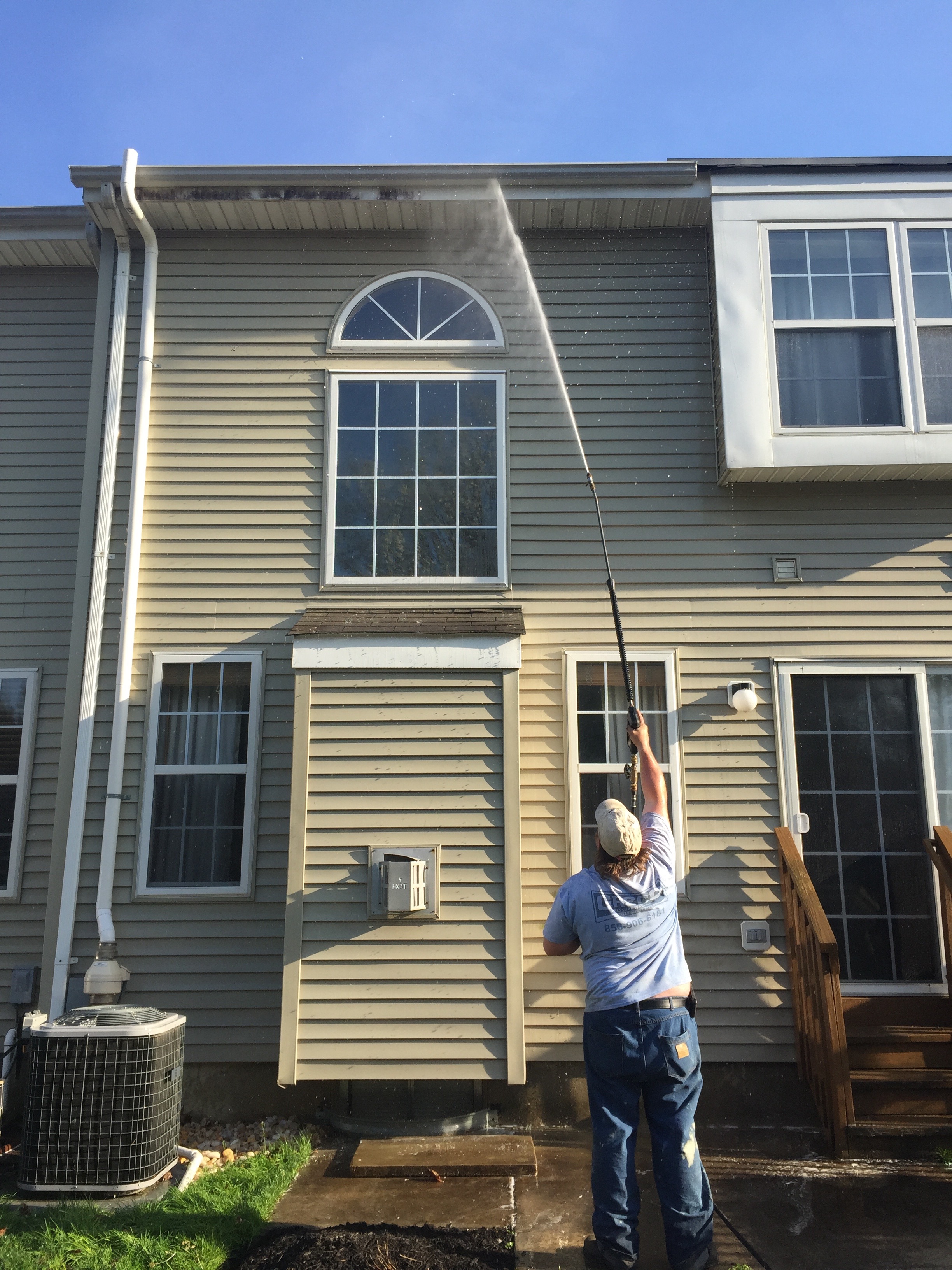 Soft Washing Professionals cleaning a gutter in Marlton New Jersey
